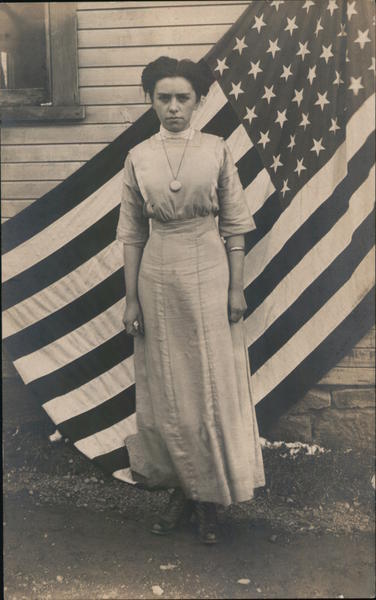 A Woman in Front of a Flag Women's Suffrage