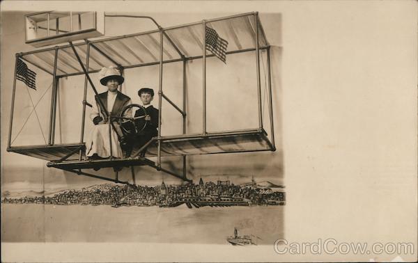 A Woman and Boy Posing in a Fake Glider San Francisco California