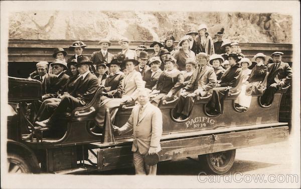 Several Men and Women in a Large Open Air Car San Francisco California