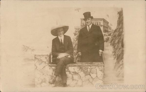 A Man Sitting on a Rock Wall and a Man Standing Behind Him San Francisco California