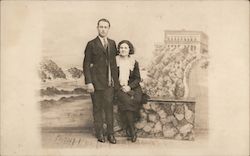 A Man and a Woman Posing on a Rock Wall Postcard