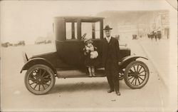 A Man and a Little Girl Next to a Car Postcard