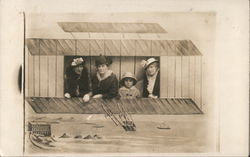 Three Women and a Girl Posing on a Fake Glider Postcard