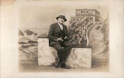 A Man Posing on a Stone Wall Postcard