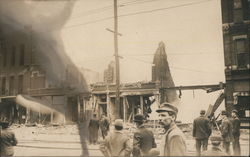 Men in the Street Looking at the Earthquake Damage Postcard