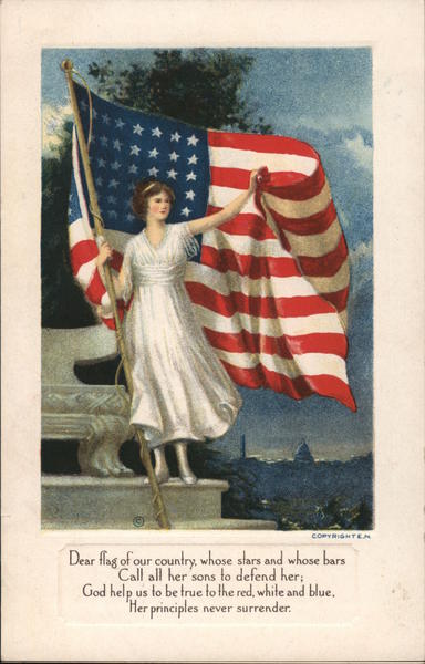 Woman in white dress standing in front of the American flag and holding it