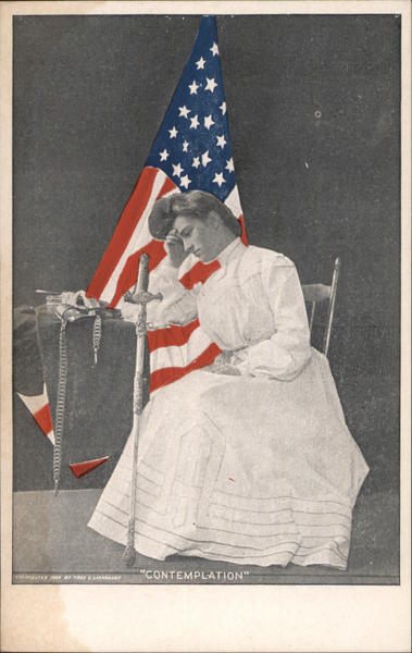 Woman sitting in front of American flag looking contemplative