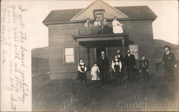 Several People Posing in Front of a House and On a Balcony of the House Watsonville California