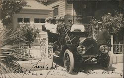 A Car Parked in a Driveway Full of People Postcard