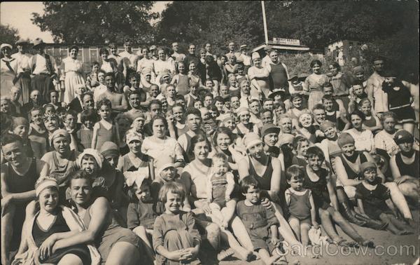 Large gGroup people posed on a beach with some in swimming gear Monte Rio California