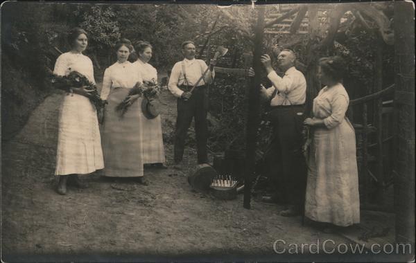Four women and two men examining timber at a lodge Monte Rio California