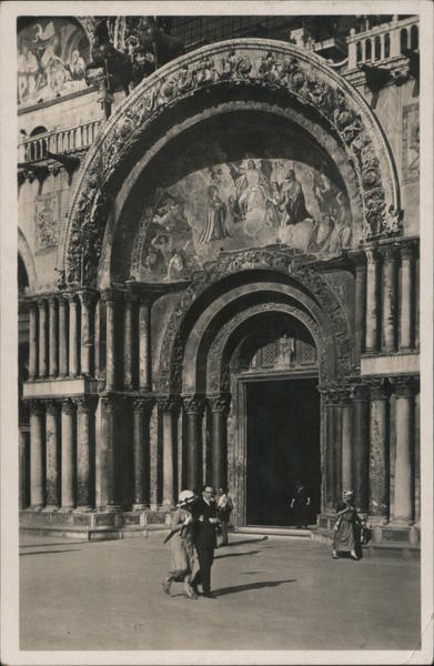 A Man and a Woman Walking in Front of an Ornate Building