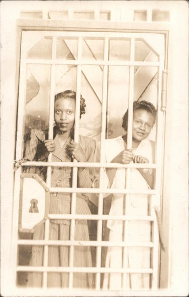 Two Women Behind Bars at Fair Black Americana