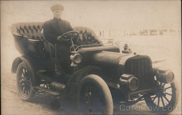 A Man Driving a Car Cars