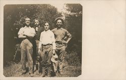 Four men stopped to pose in the woods Postcard