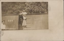 Woman on the Side and Top of a Train Postcard