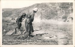 The Old Fisher Woman at Bodega Bay Looking Over Their Catch of Surf Fish in the Hole in the Sand Postcard