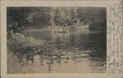 Three people in small boat on river Postcard