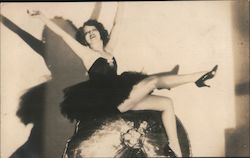 A Woman in a Short Dress Kicking Her Leg Postcard