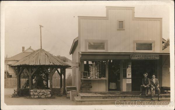 Two Men Sitting in Front of a Store Guerneville California
