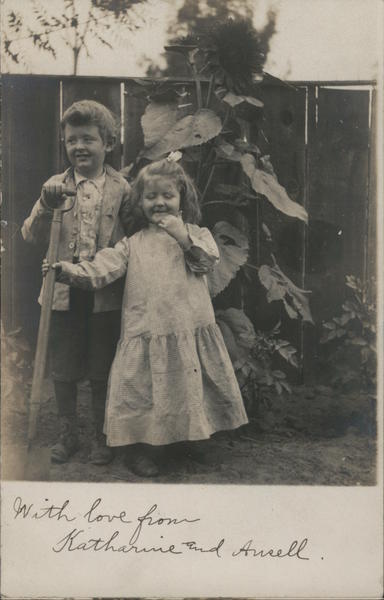 Two Little Kids in Front of a Fence Guerneville California