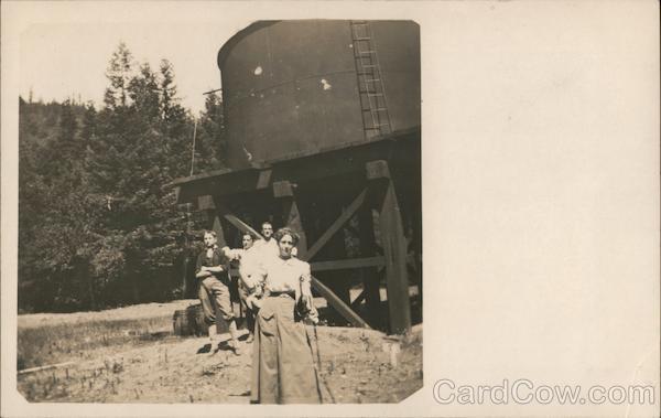 Four People Standing in front of a Water Tank Guerneville California