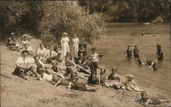 A Group of People on the Bank of a River and in the River Guerneville California