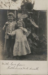 Two Little Kids in Front of a Fence Postcard