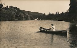 A Woman Canoeing in the River Postcard