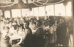 Lots of People Sitting at Tables in a Pavillion Postcard