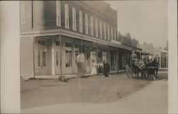 Horses and Wagon front of Store Postcard