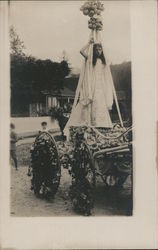 A Woman with a Large Head Piece Postcard