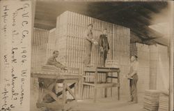Four Men Working in a Warehouse Postcard