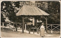 A Woman Standing at the Entrance of Summerland Postcard