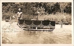 A Man in a Swimsuit next to a Body of Water Postcard