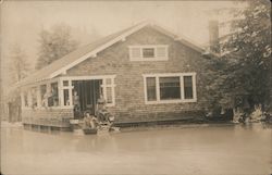 People Standing on the Front Porch With Flood Waters Up to the Porch Postcard