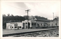 Train Depot and Riggs Realty Co. Postcard