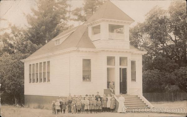Garberville Cal School. School house with teacher and all students out front. California