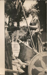 Girl in toga standing in chariot drawn by horse, Parade Postcard