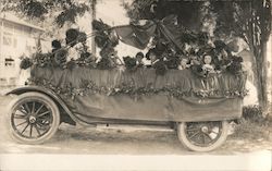 July 4, 1917 open car parade float with children and large flowers Postcard