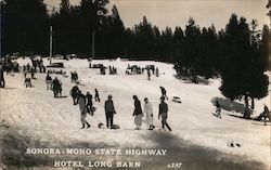 Sonora - Mono State Highway Hotel Long Barn. People playing in snow with sleds. California Postcard Postcard Postcard