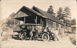 Family around old Touring Car Postcard