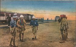 Picture of men and soldiers in front of train station Postcard