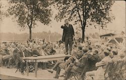 Roosevelt on table speaking to large group of men Postcard