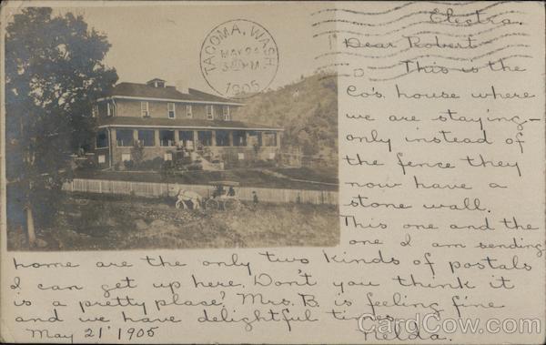 Large house on a hill with horse drawn carriage traveling up hill Electra California