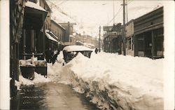 Ghost Town: Snowy Street Scene & Butte Bar Cafe Postcard