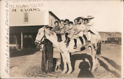 Burro with eight children Postcard