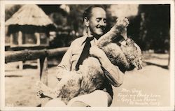 Mr. Gay Feeding Baby Lion - Gay's Lion Farm Postcard