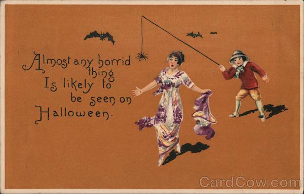 Almost any horrid thing Is likely to be seen on Halloween - Lady being scared by boy's fake spider.