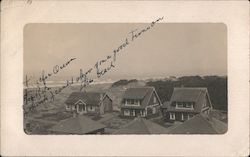 view of houses and the Pacific Ocean Postcard